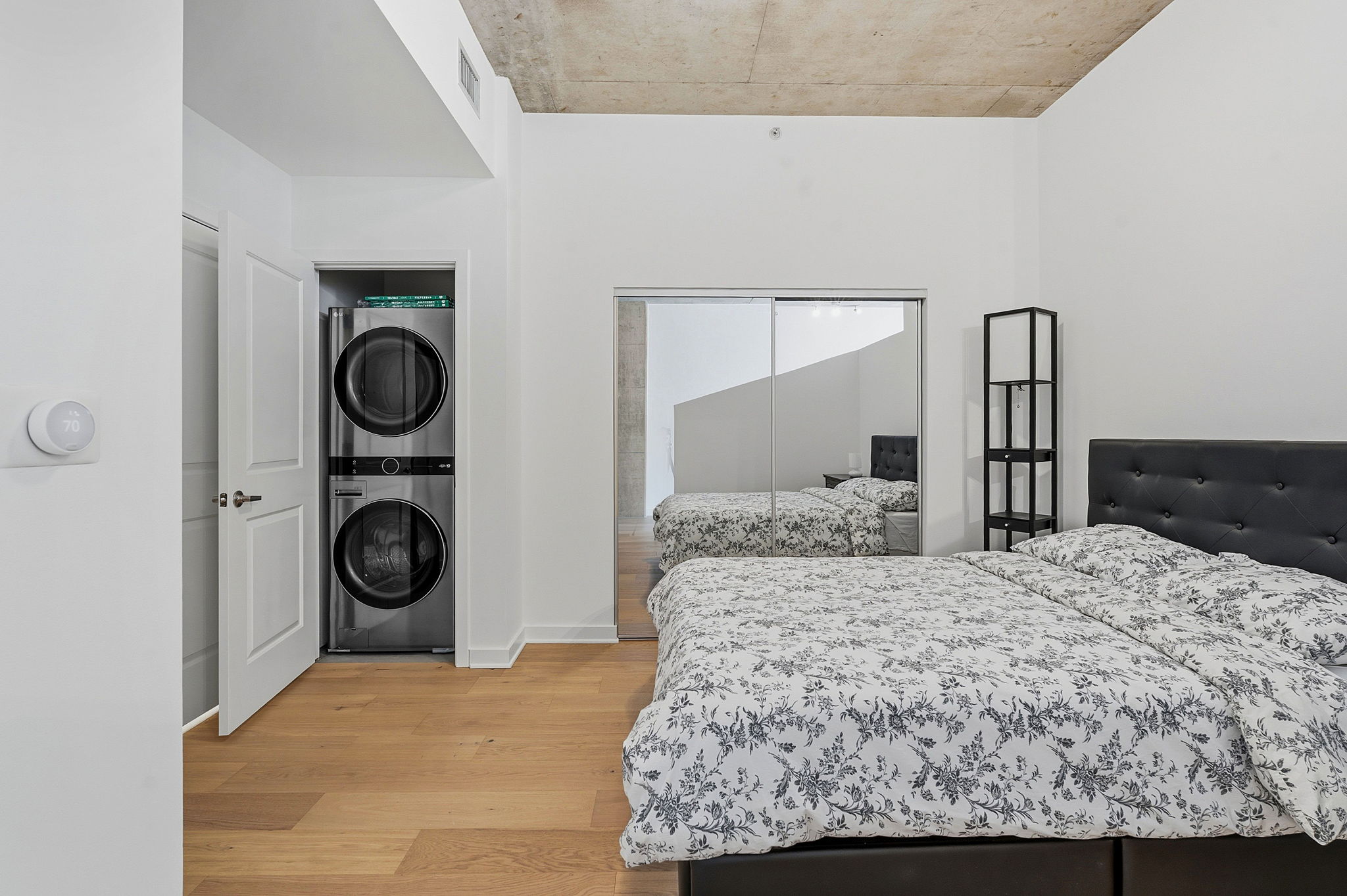 360 Nueces Street, Unit 1303 Austin, TX 78701 - Photo 14 of 40 a bedroom with a bed and a closet