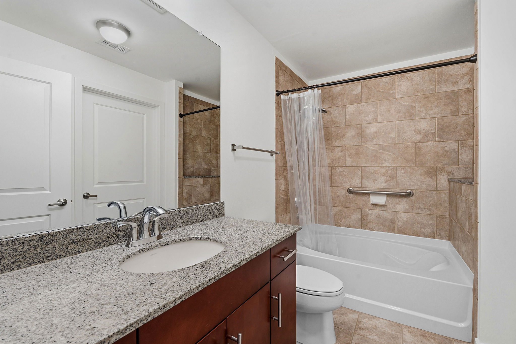 360 Nueces Street, Unit 1303 Austin, TX 78701 - Photo 15 of 40 a bathroom with a granite countertop sink toilet and shower