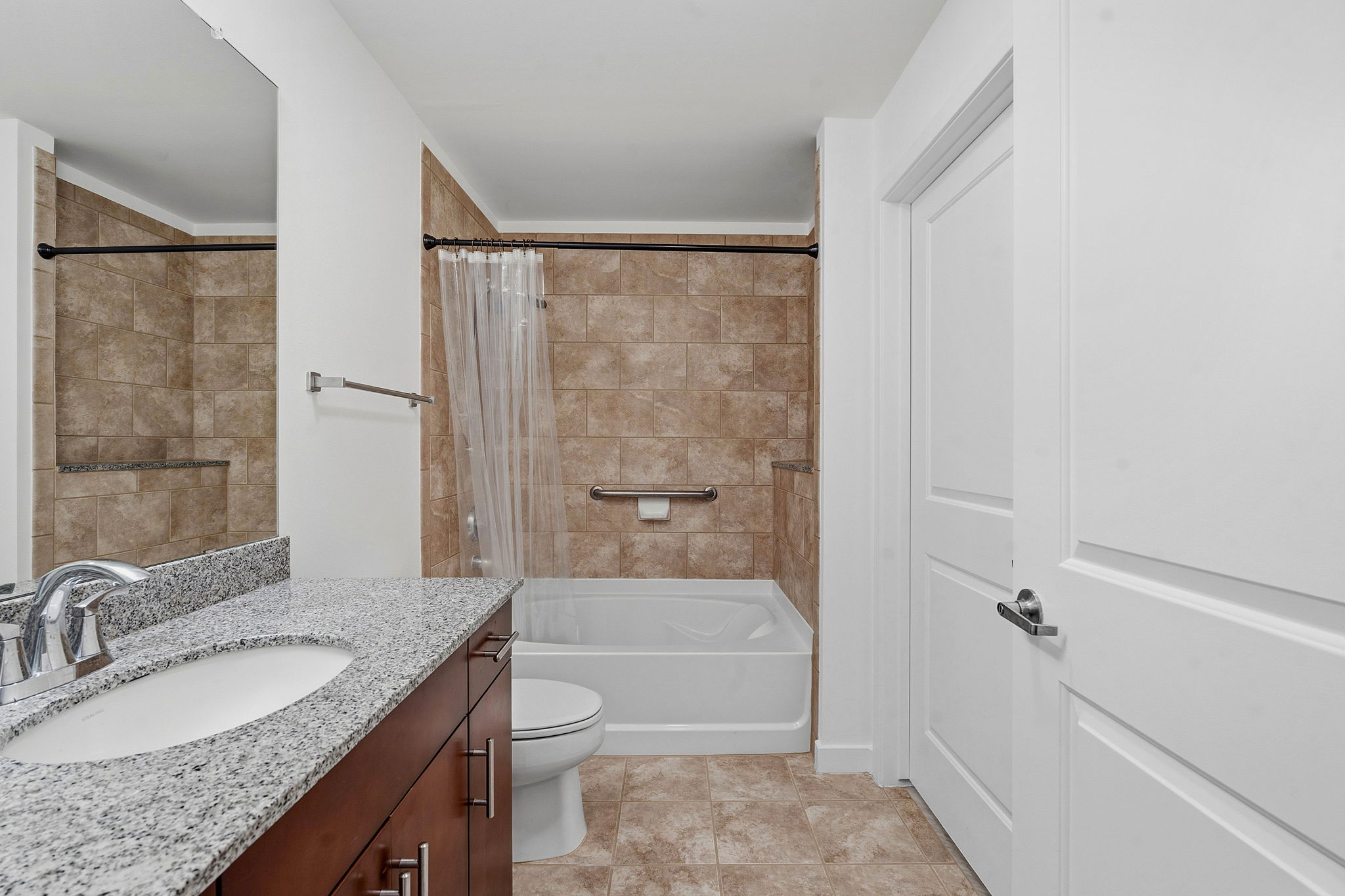 360 Nueces Street, Unit 1303 Austin, TX 78701 - Photo 16 of 40 a bathroom with a granite countertop sink toilet and shower