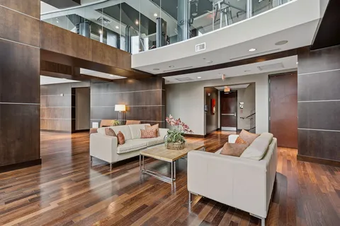 a living room with furniture and a large window