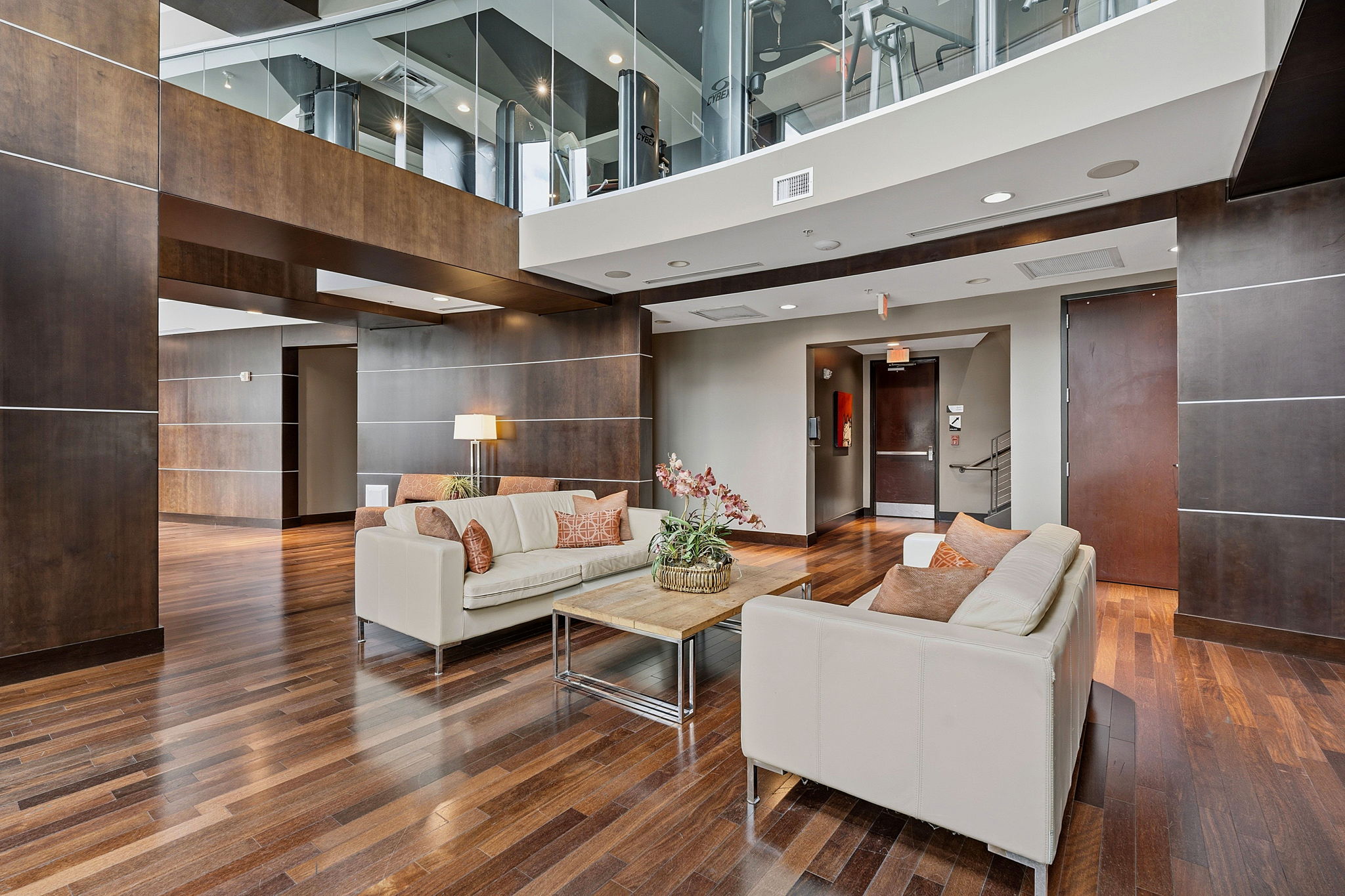360 Nueces Street, Unit 1303 Austin, TX 78701 - Photo 32 of 40 a view of a patio with couches table and chairs with wooden floor