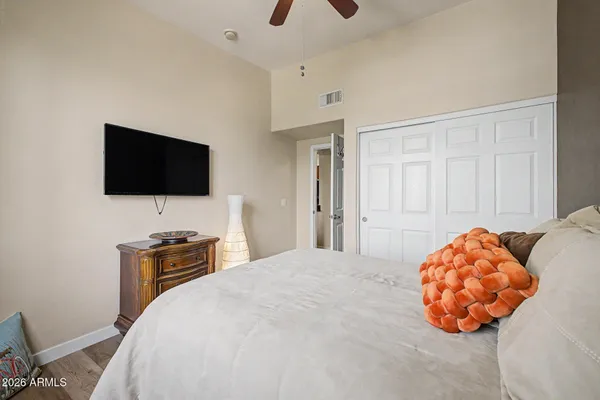 a bedroom with a bed and a window