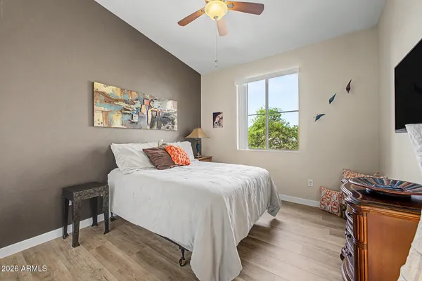 a bedroom with a bed and a dresser