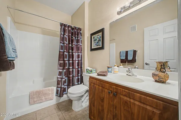 a white toilet sitting next to a bathroom