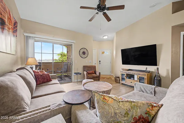 a living room with furniture and a flat screen tv