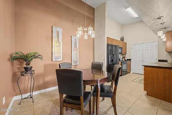 a kitchen with stainless steel appliances granite countertop a sink a stove and refrigerator