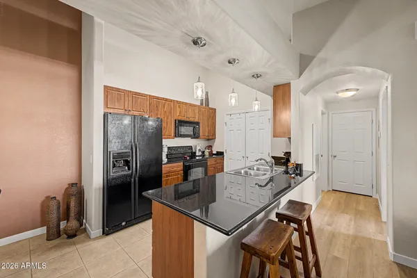 a kitchen with a stove a refrigerator and a stove
