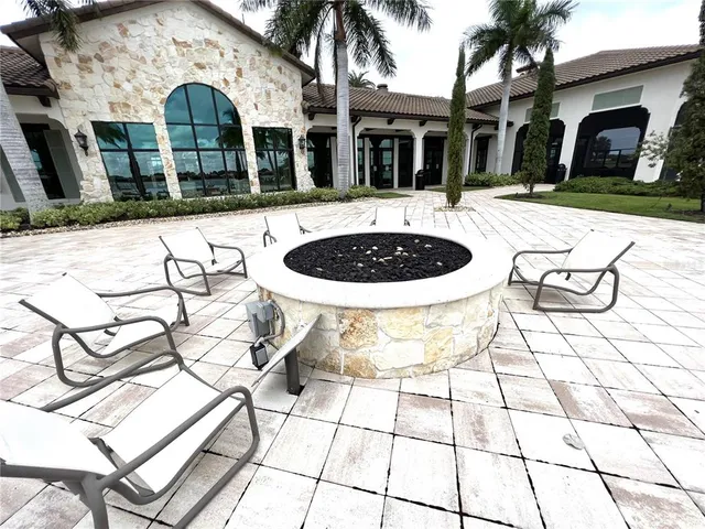 a front view of a building with a yard