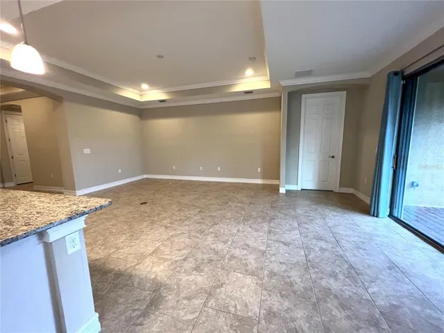 a view of a hallway with granite countertop