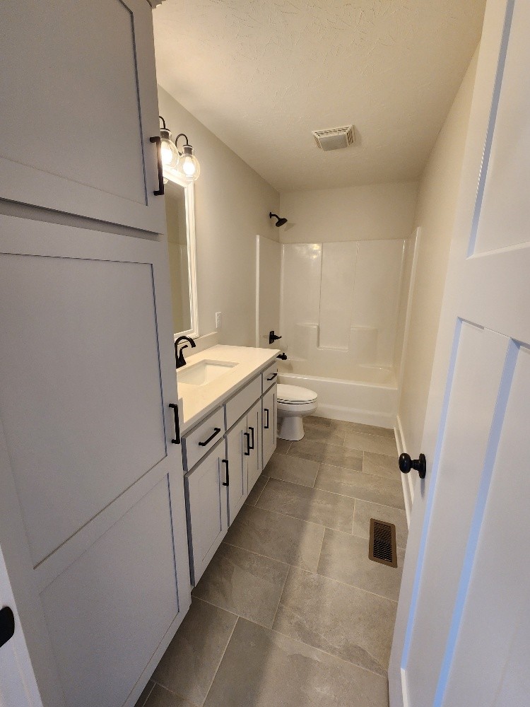 670 Armstrong Road Castalian Springs, TN 37031 - Photo 14 of 25 a utility room with cabinets washer and dryer