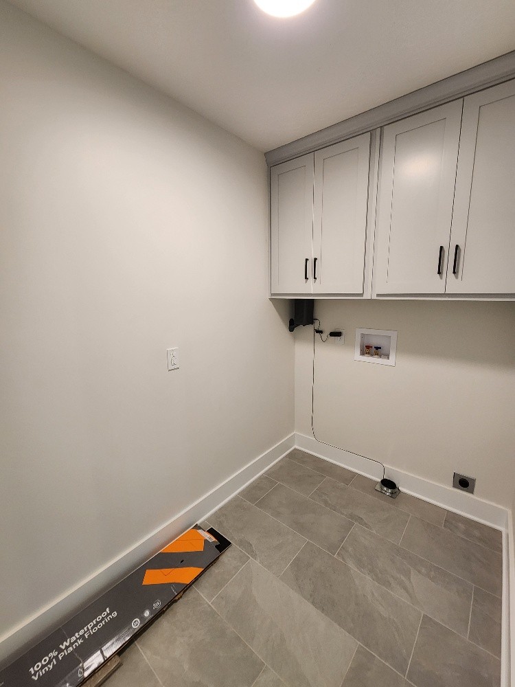 670 Armstrong Road Castalian Springs, TN 37031 - Photo 19 of 25 a view of cabinets and utility room