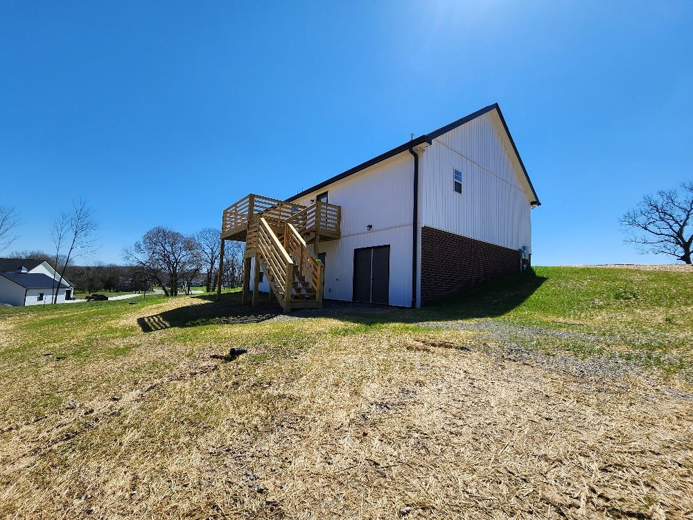 670 Armstrong Road Castalian Springs, TN 37031 - Photo 2 of 25 a backyard of a house with wooden fence