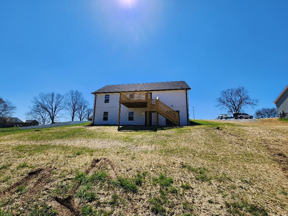 670 Armstrong Road Castalian Springs, TN 37031 - Photo 3 of 25 a house with trees in front of it