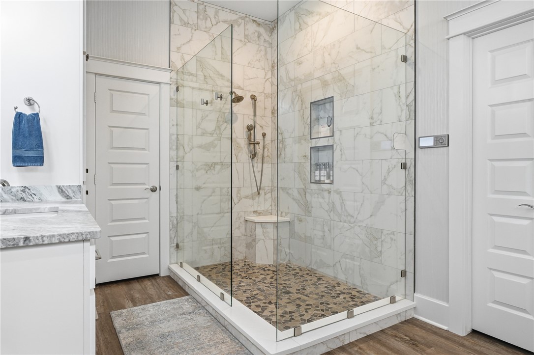 12 Sea Shell Shores Rockport, TX 78382 - Photo 17 of 40 a bathroom with a granite countertop sink a shower and a mirror