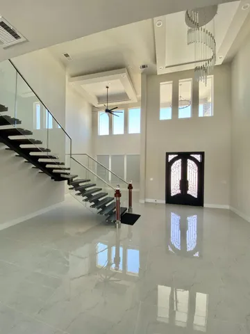 a view of a livingroom with furniture and staircase