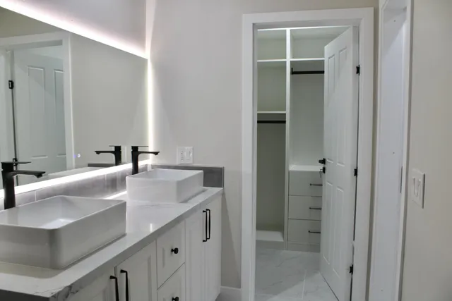 a bathroom with a sink and toilet