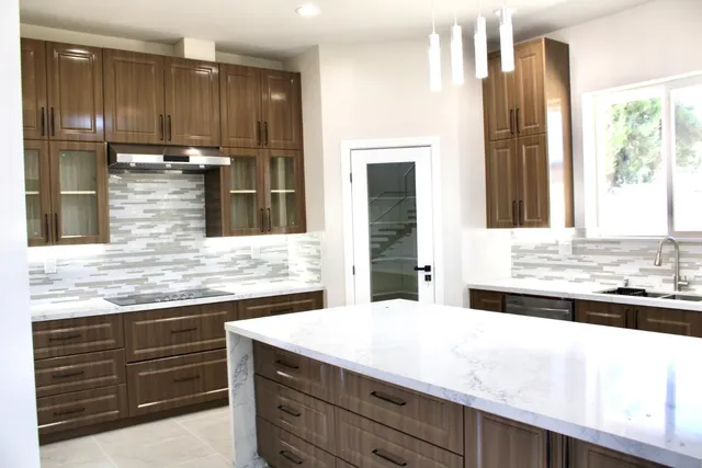 a bathroom with a sink and a large mirror