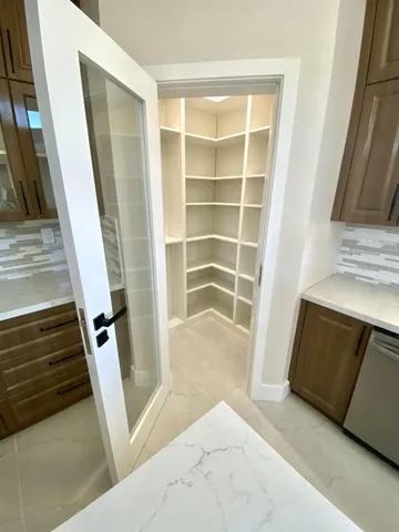 a view of front door with hallway and stairs