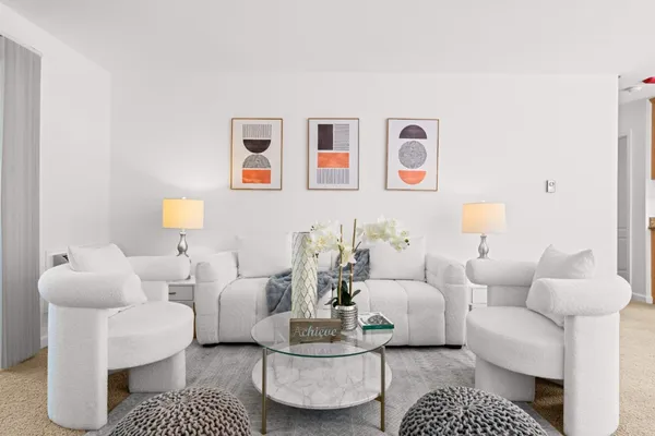 a living room with furniture and a couch