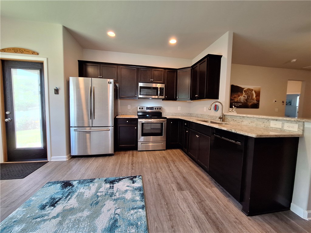 3 Cringle Lane Anderson, SC 29625 - Photo 5 of 26 A well-appointed kitchen features dark wood cabinetry and modern stainless steel appliances.