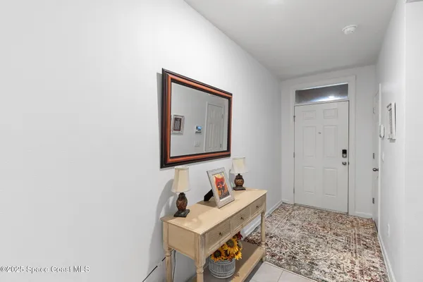 a room with furniture and mirror