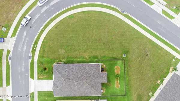 a view of a swimming pool with a yard