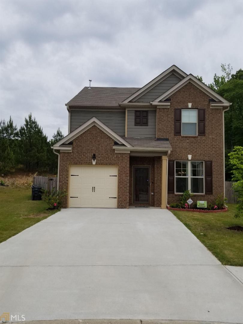 5804 Grande River Road Atlanta, GA 30349 - Photo 1 of 1 a front view of a house with garden