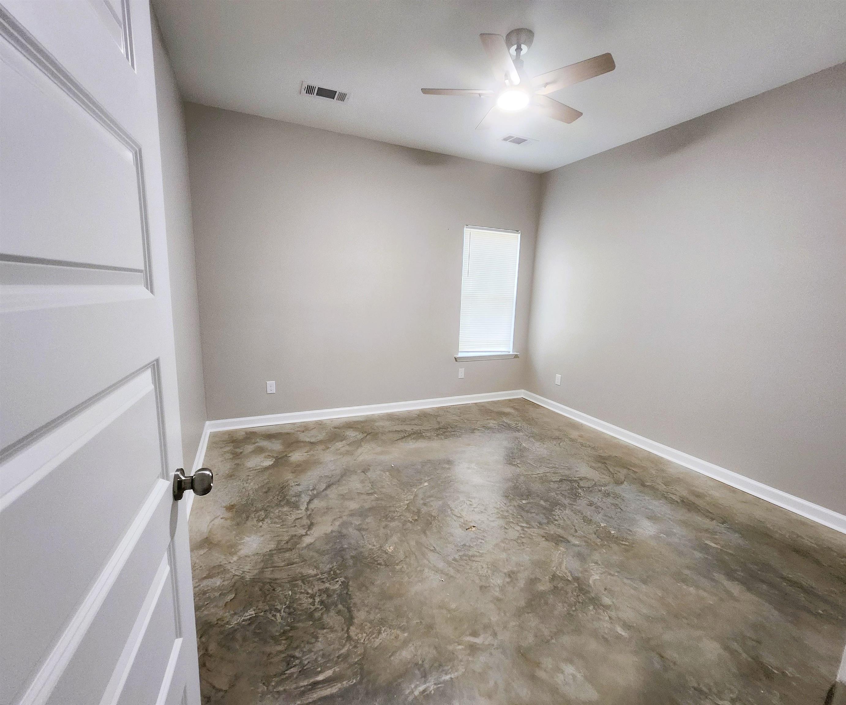 1249 Marksman Street Memphis, TN 38106 - Photo 8 of 10 a view of empty room with ceiling fan