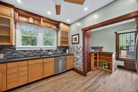 a kitchen with stainless steel appliances granite countertop a stove and a sink