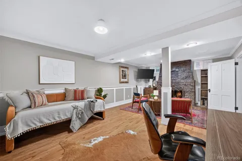 a bedroom with furniture and a wooden floor