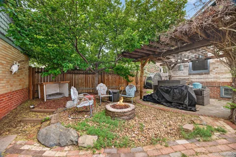 a view of a backyard with sitting area