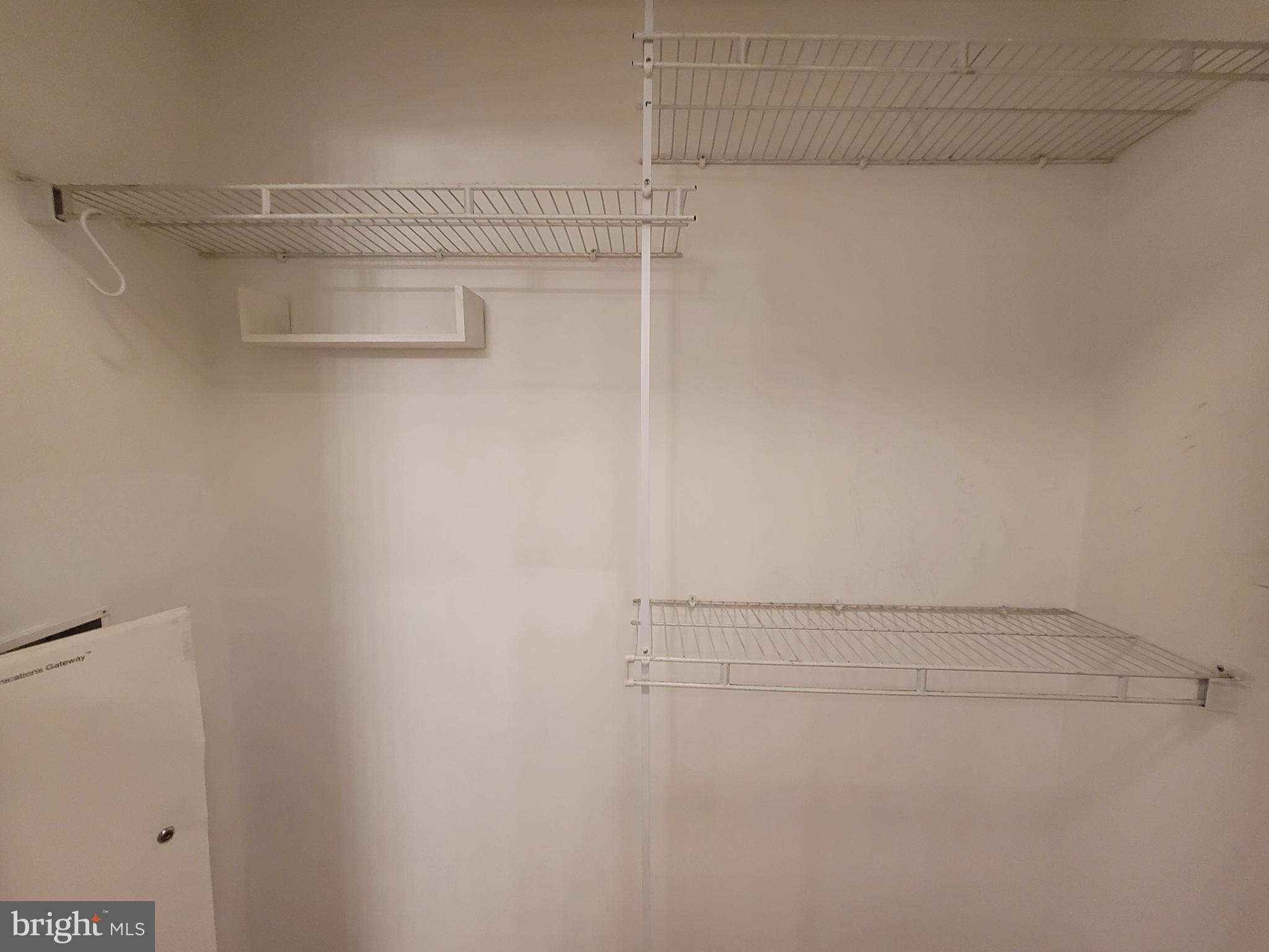 616 E Street Northwest, Unit 1007 Washington, DC 20004 - Photo 18 of 99 a view of a room with racks on the wall