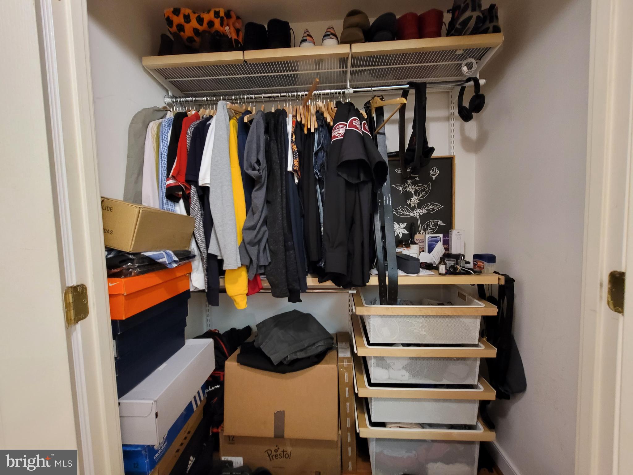616 E Street Northwest, Unit 1007 Washington, DC 20004 - Photo 46 of 99 a view of walk in closet with clothes and shoes