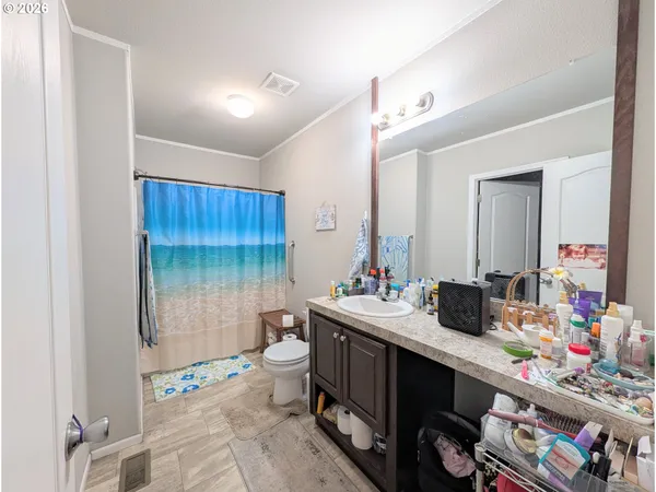 a room with a sink and a mirror
