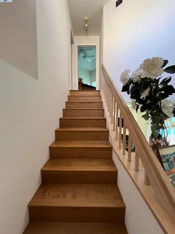 a bathroom with a tub a sink and a window