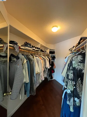 a white toilet sitting next to a shower