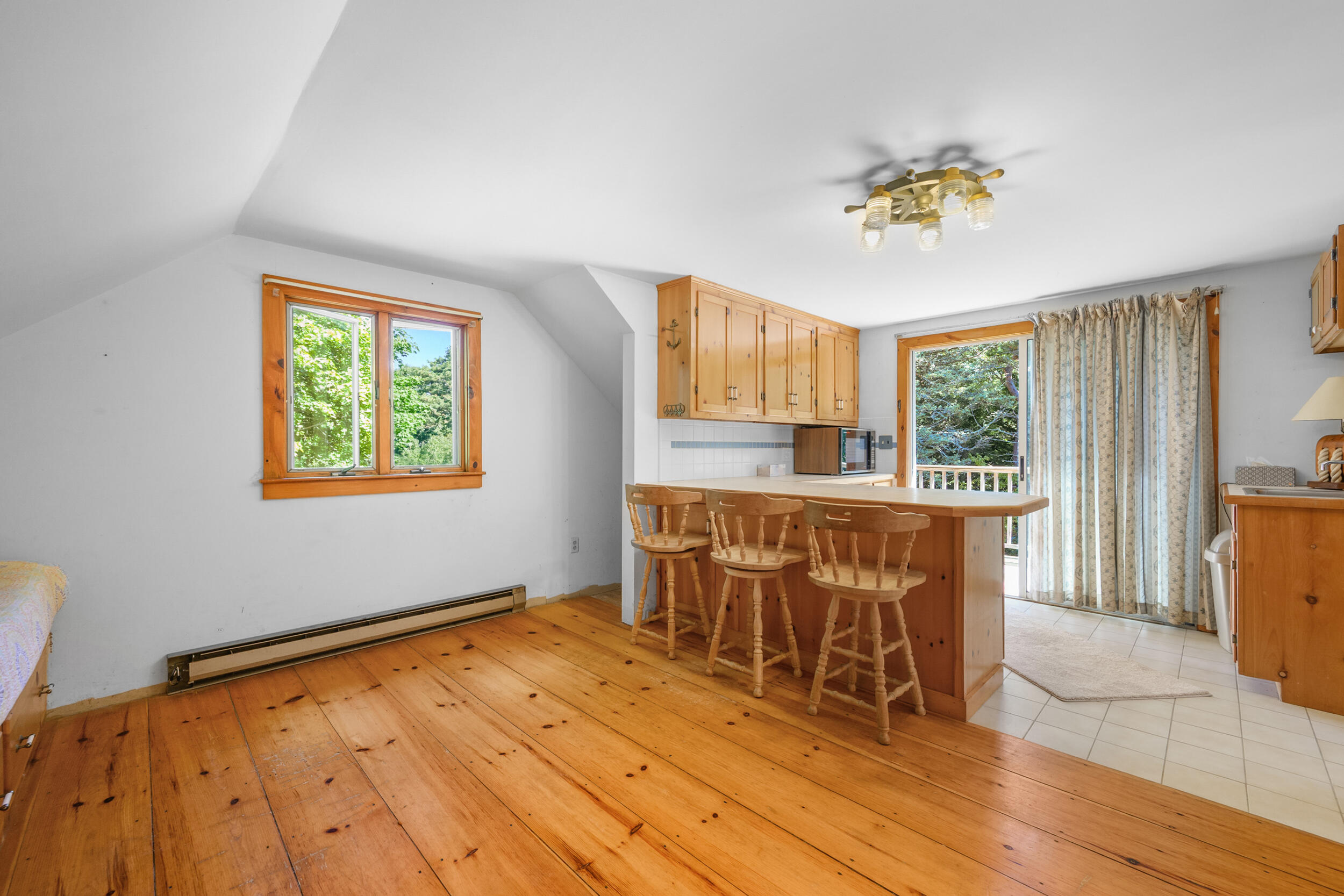 10 Mc Guerty Road Eastham, MA 02642 - Photo 25 of 39 a view of a room with a window and wooden floor