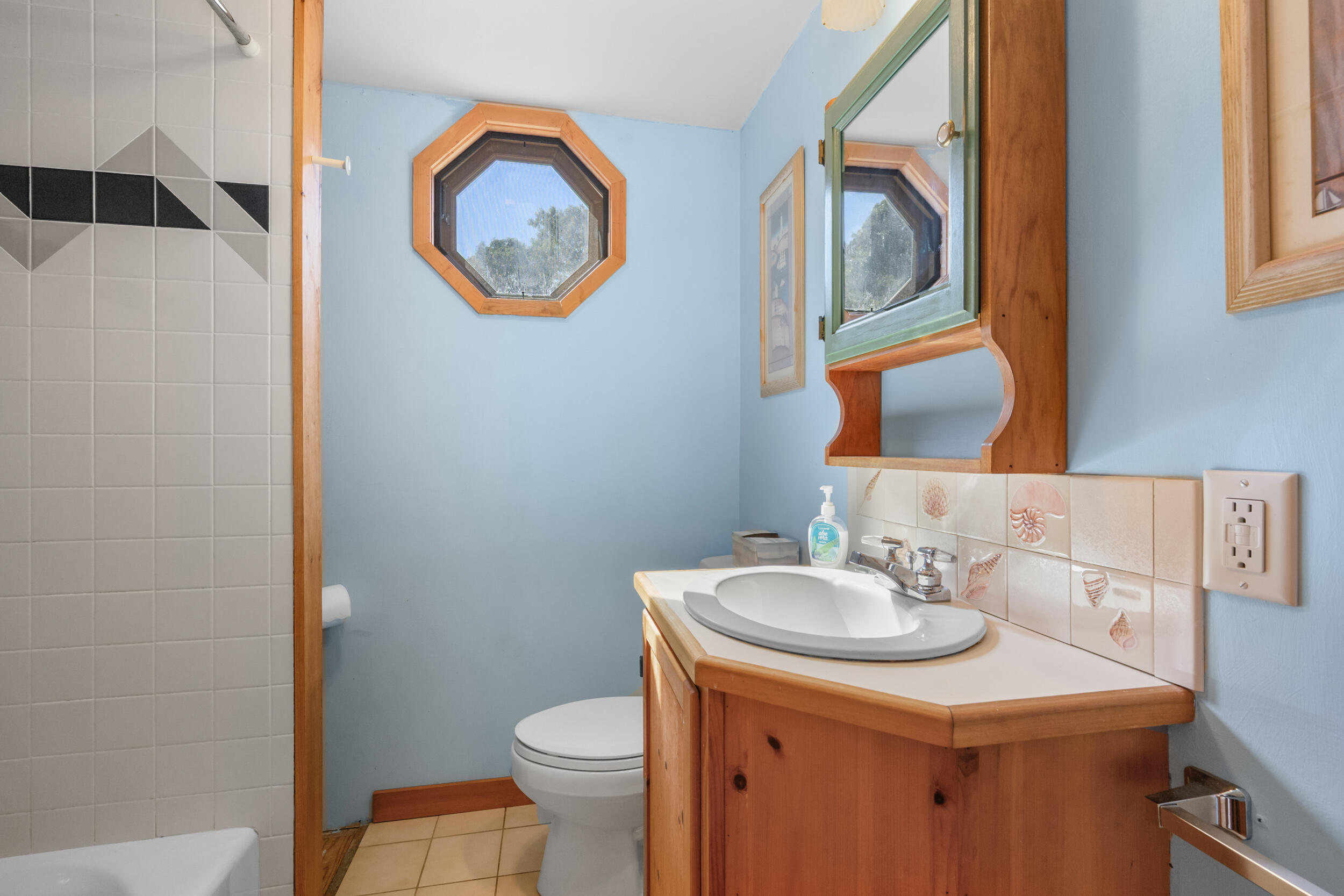 10 Mc Guerty Road Eastham, MA 02642 - Photo 28 of 39 a bathroom with a sink and a mirror
