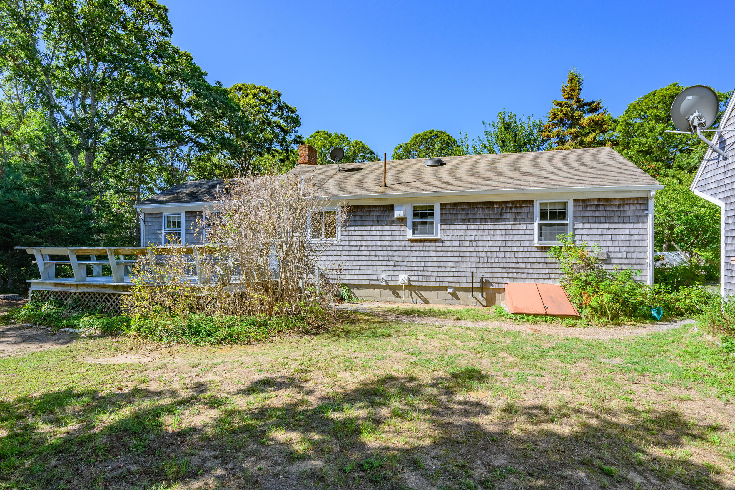 10 Mc Guerty Road Eastham, MA 02642 - Photo 32 of 39 a view of house with backyard and garden
