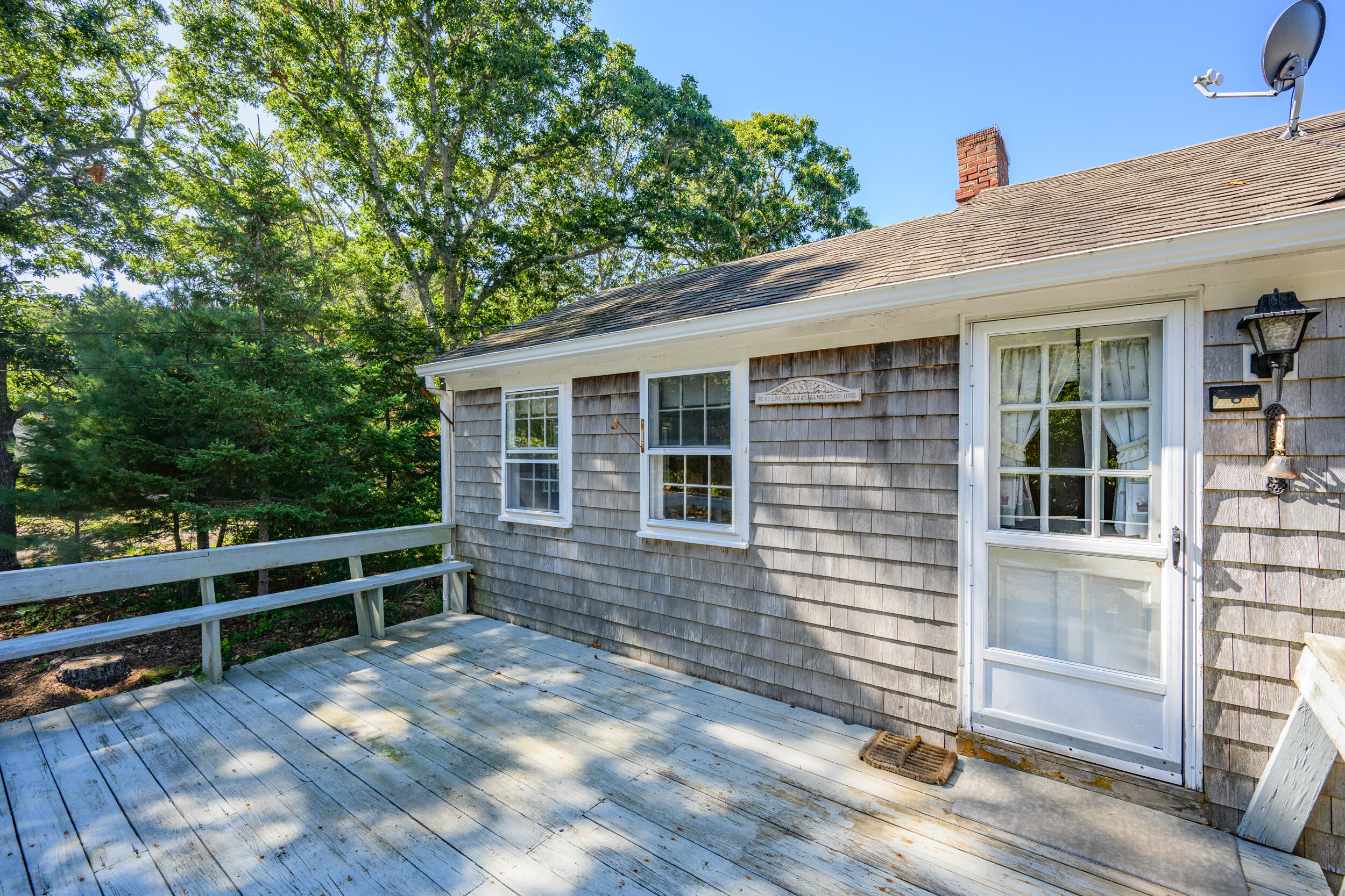 10 Mc Guerty Road Eastham, MA 02642 - Photo 33 of 39 a view of backyard with hardwood and deck