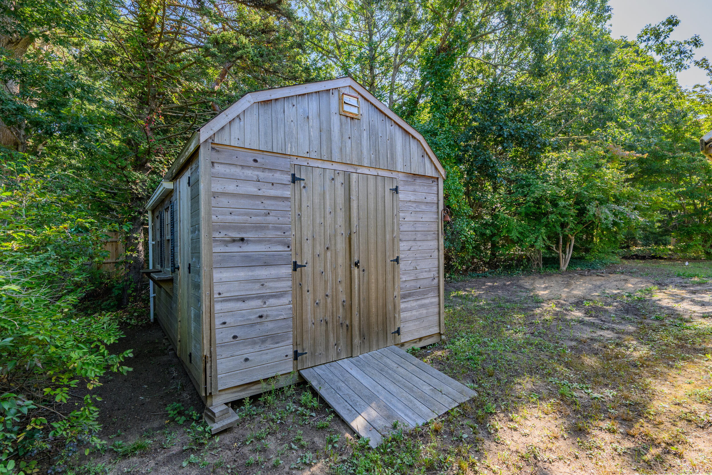 10 Mc Guerty Road Eastham, MA 02642 - Photo 39 of 39 a view of backyard with tub and trees
