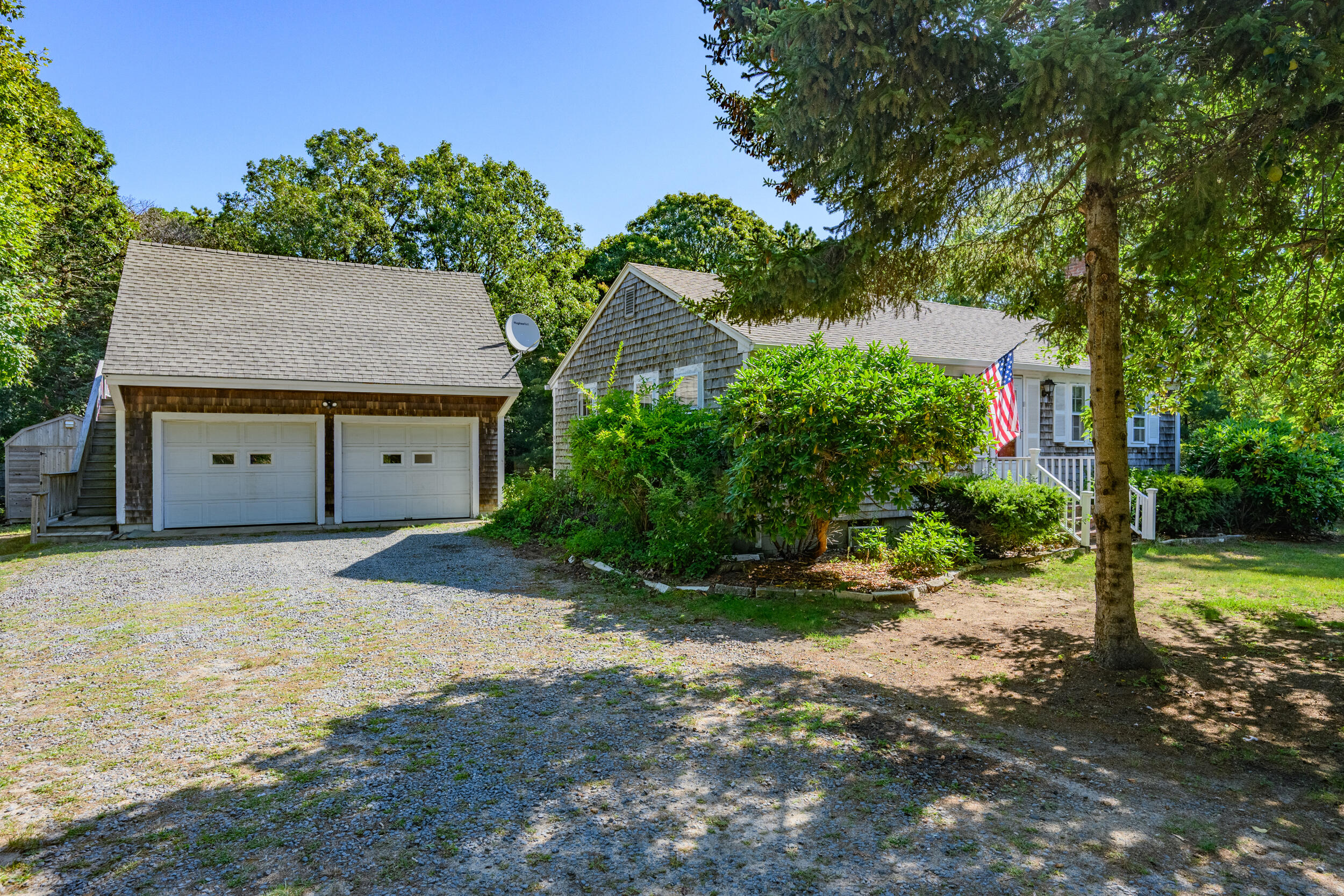 10 Mc Guerty Road Eastham, MA 02642 - Photo 5 of 39 a view of a house with a yard and plants
