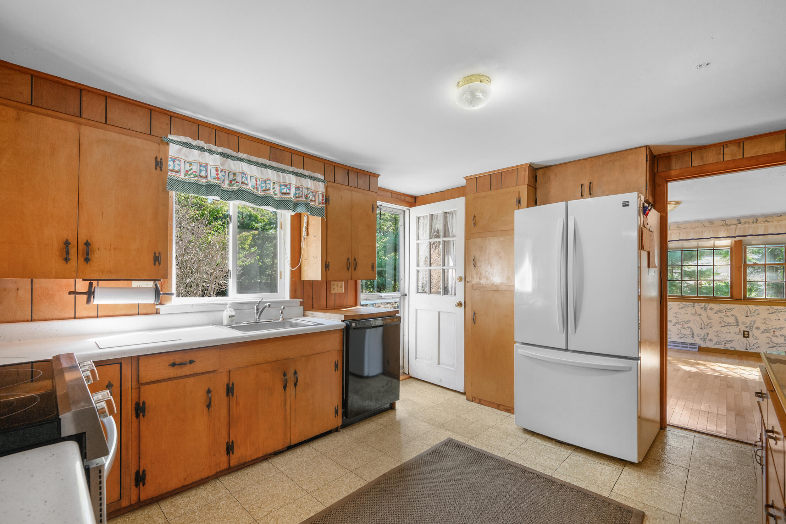 10 Mc Guerty Road Eastham, MA 02642 - Photo 6 of 39 a kitchen with a refrigerator sink and stove