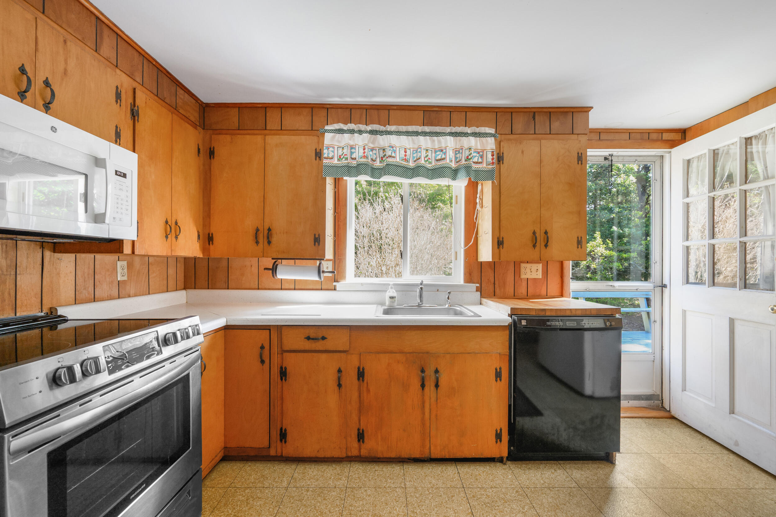 10 Mc Guerty Road Eastham, MA 02642 - Photo 7 of 39 a kitchen with a stove and a sink