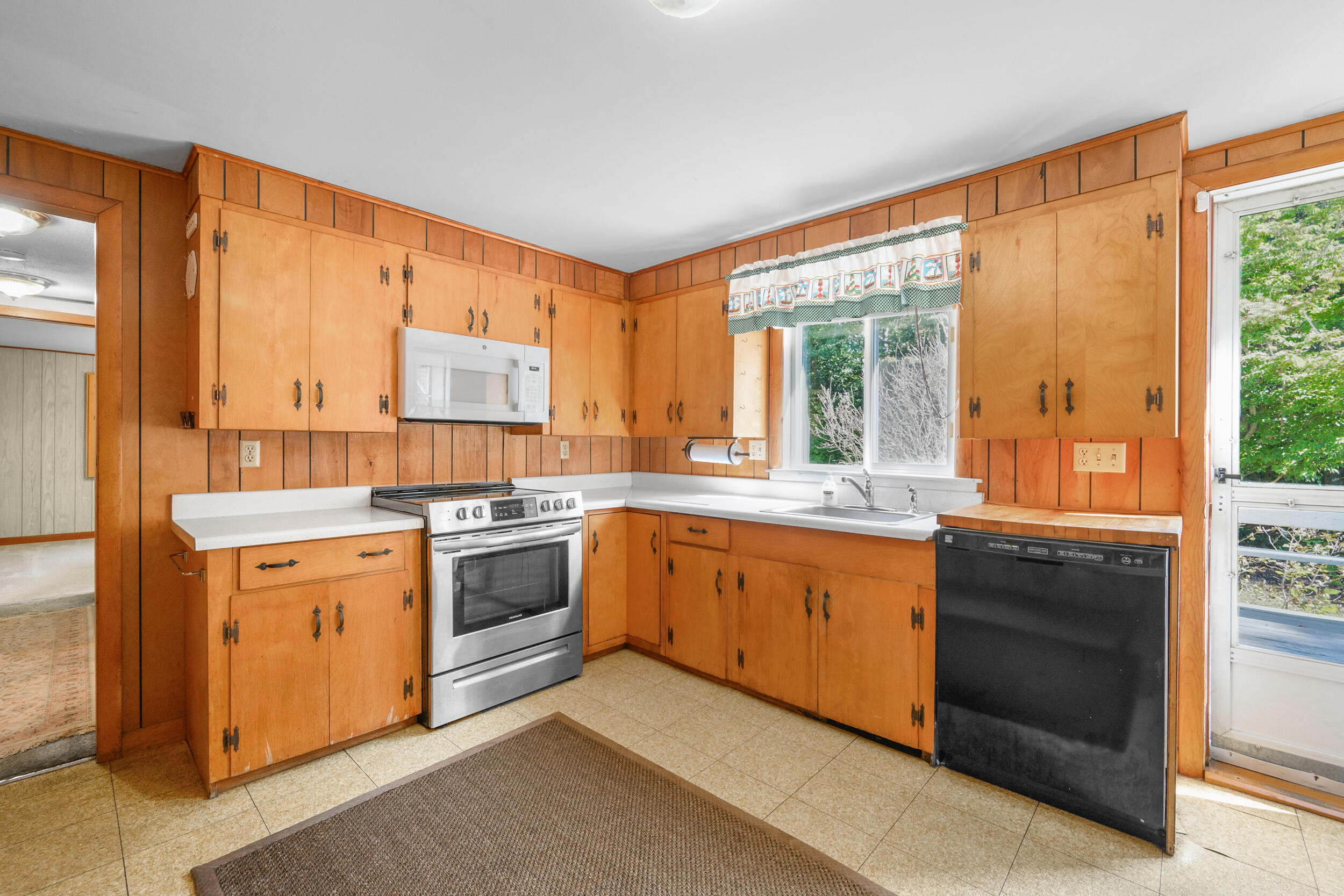 10 Mc Guerty Road Eastham, MA 02642 - Photo 8 of 39 a kitchen with a stove a sink and a refrigerator