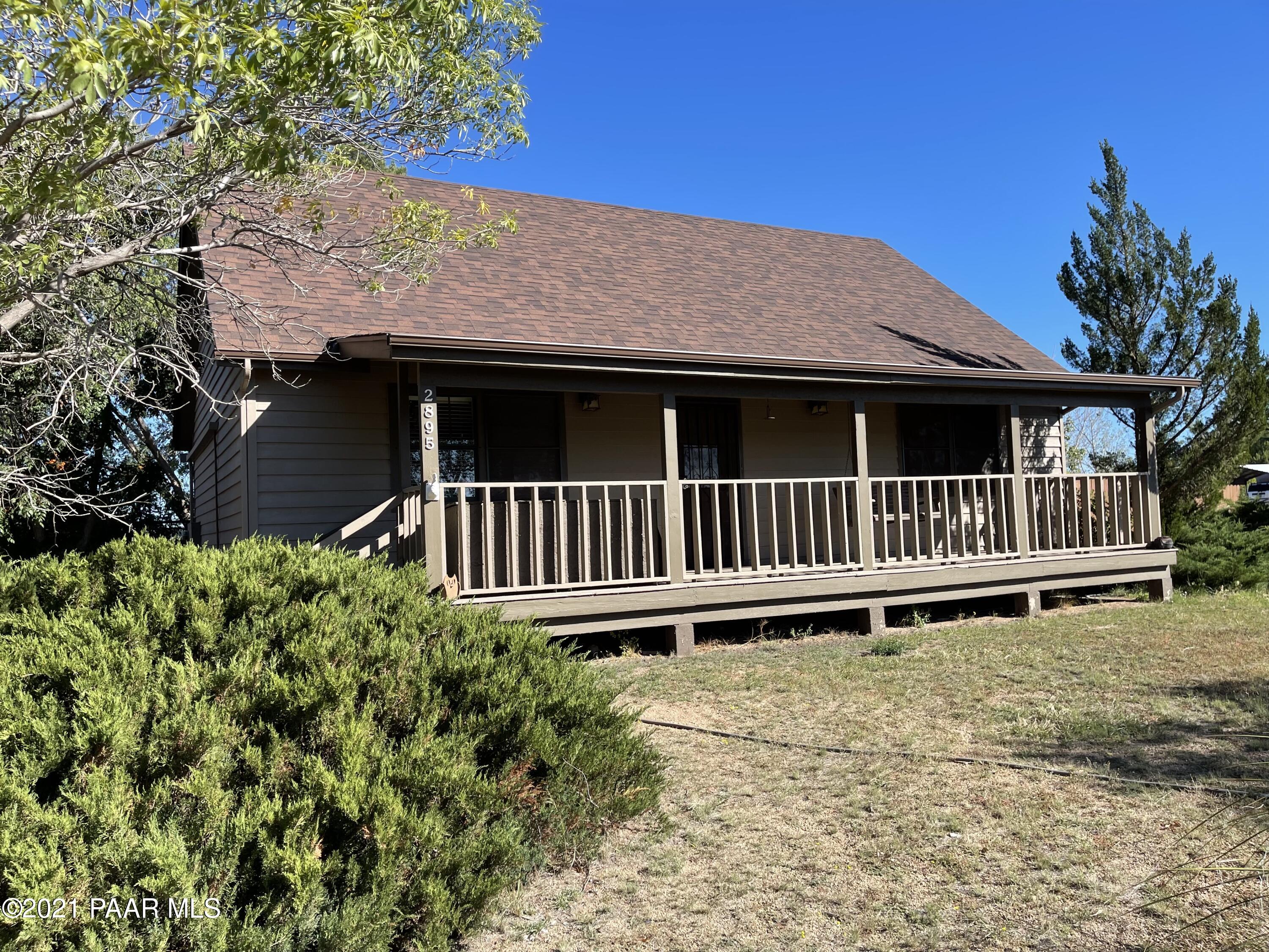 2895 North Reed Road Chino Valley, AZ 86323 - Photo 1 of 40 a backyard of a house with a deck