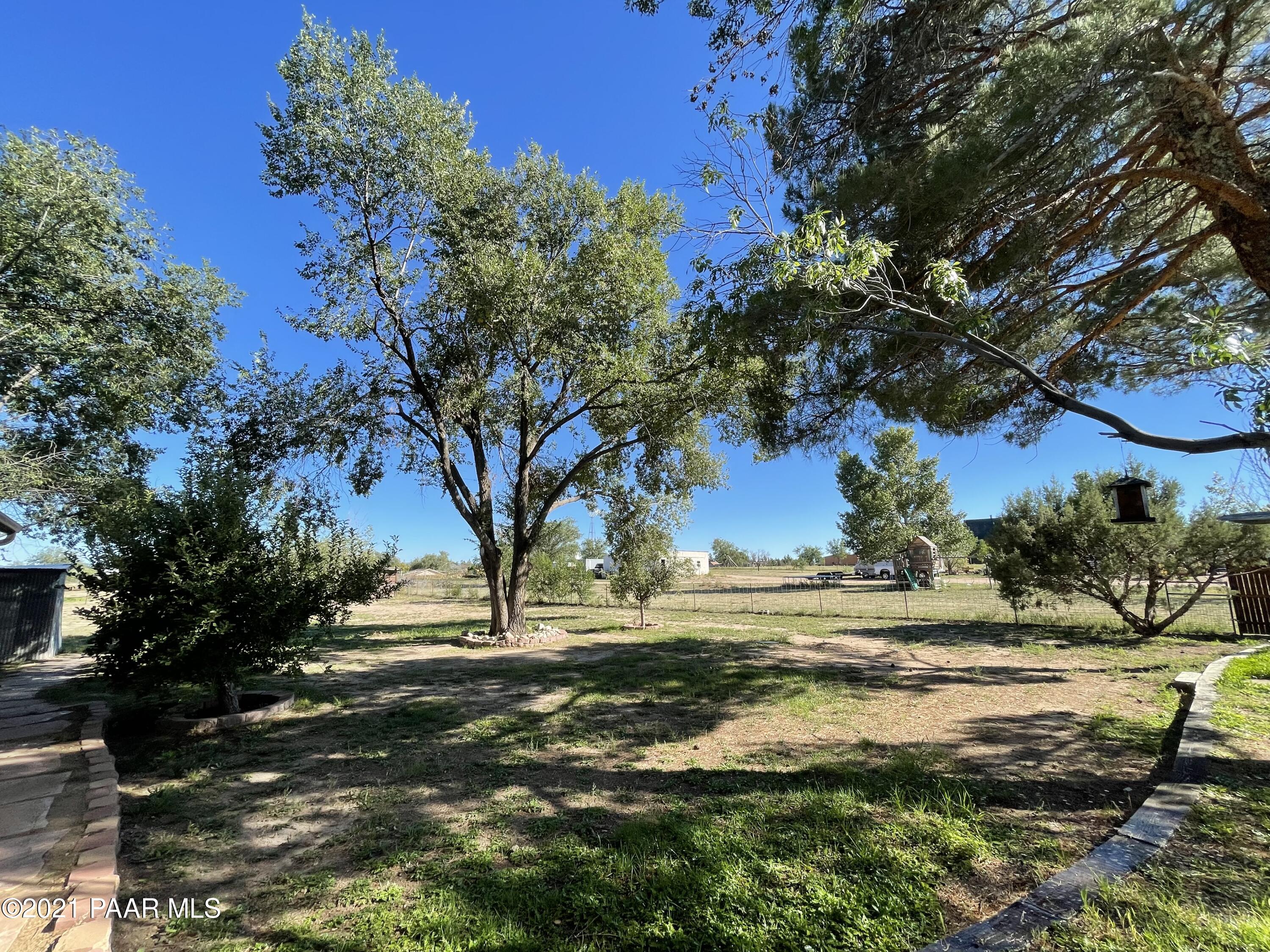 2895 North Reed Road Chino Valley, AZ 86323 - Photo 34 of 40 a view of dirt yard with large trees