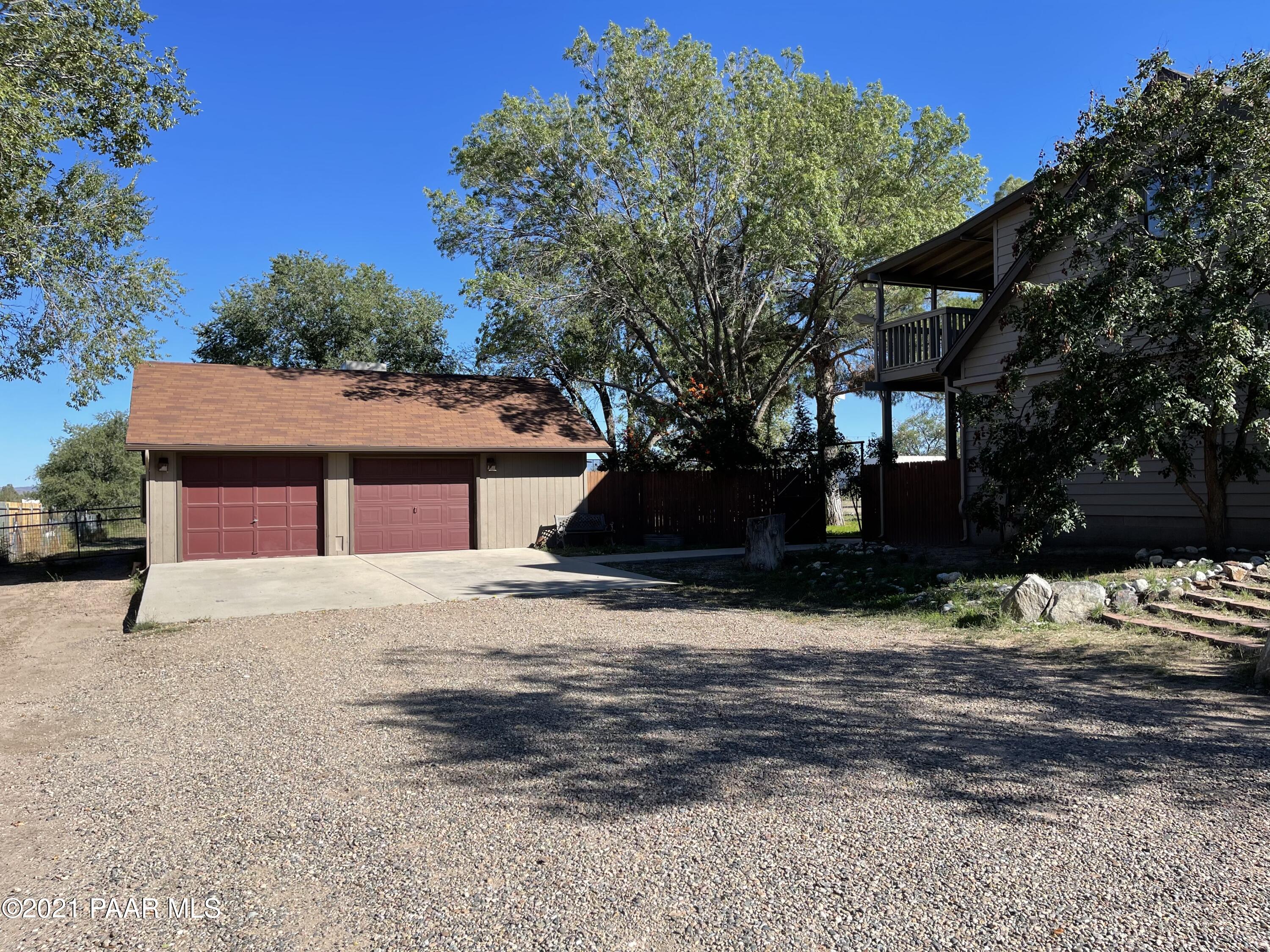 2895 North Reed Road Chino Valley, AZ 86323 - Photo 4 of 40 a front view of a house with a yard