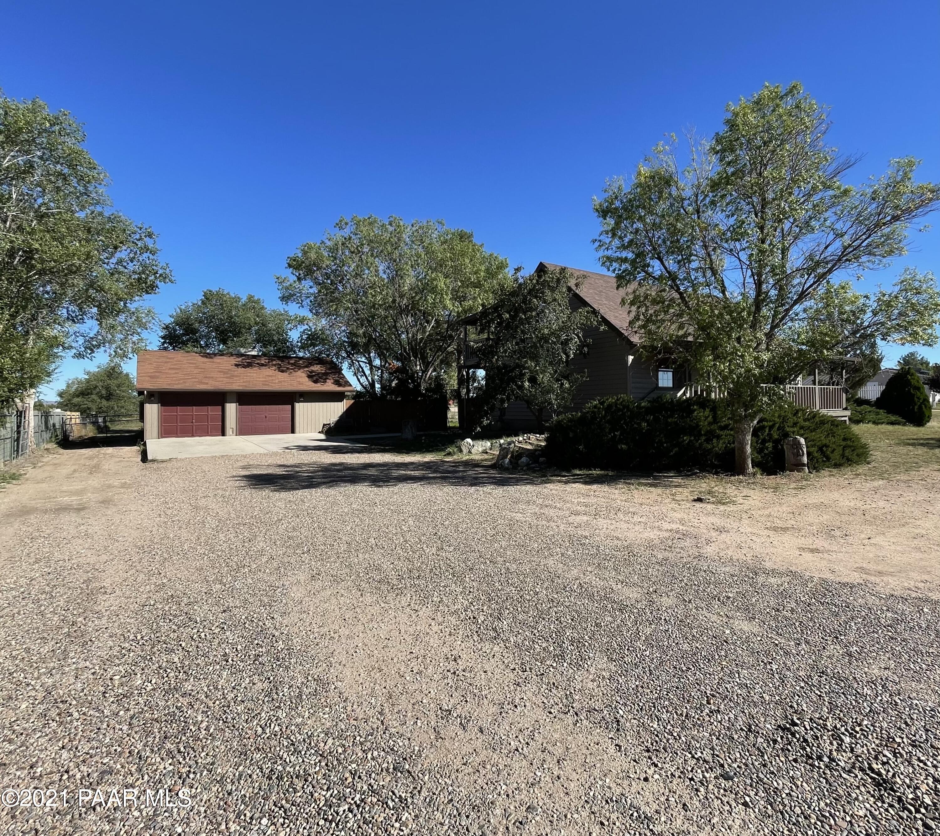 2895 North Reed Road Chino Valley, AZ 86323 - Photo 5 of 40 a front view of a house with a yard