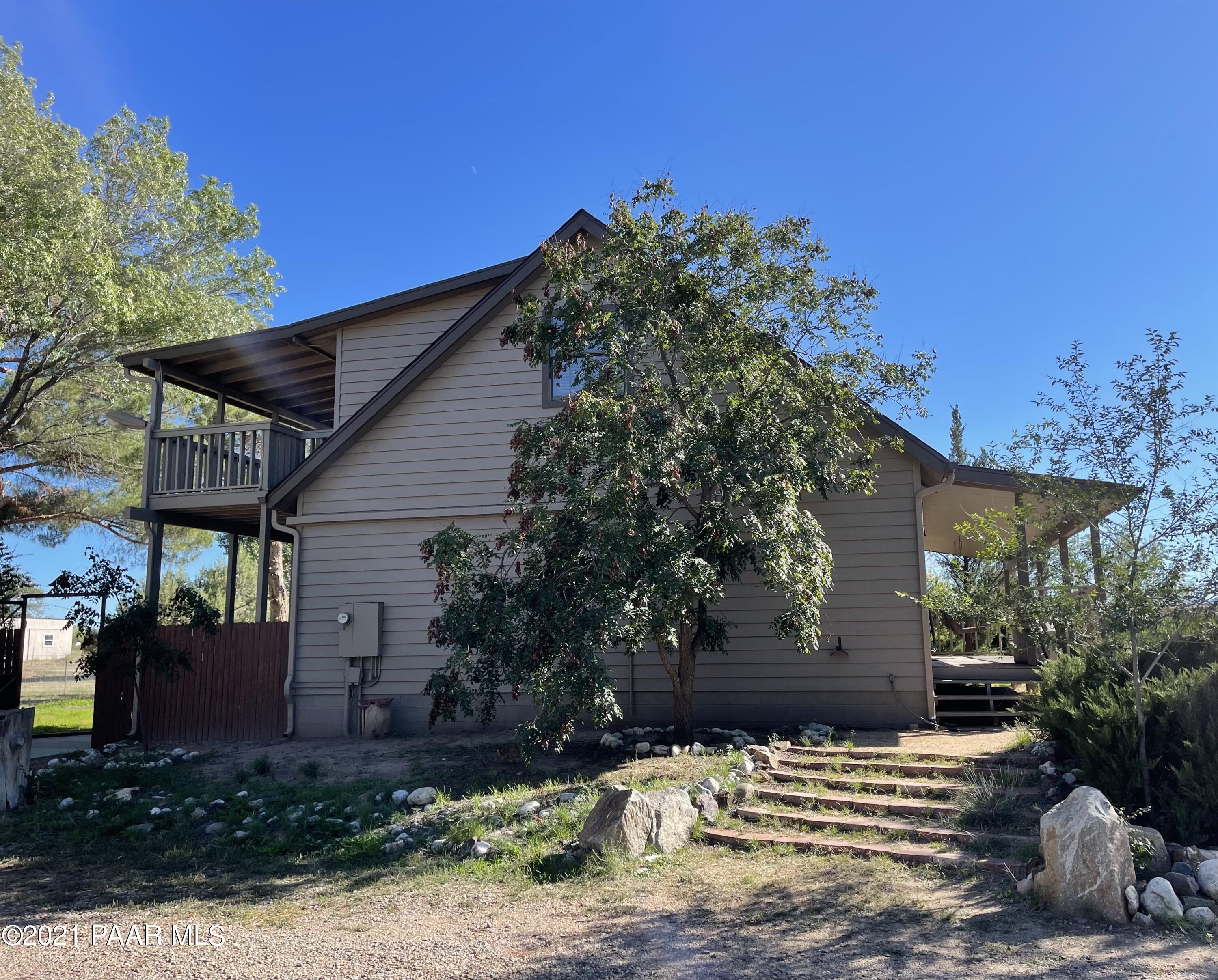 2895 North Reed Road Chino Valley, AZ 86323 - Photo 6 of 40 a view of a house with a yard